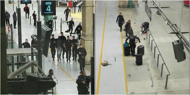 El hombre siendo detenido en la estación de trenes de París