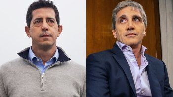 Wado de Pedro y Luis Caputo.
