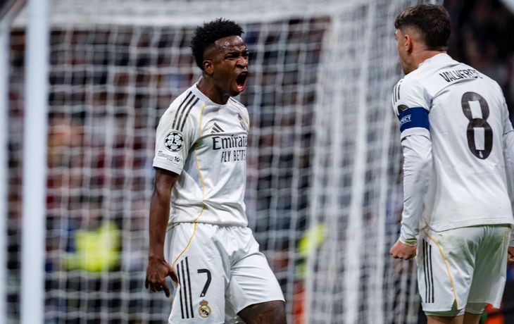 Real Madrid, con gol de Vinicius después de la polémica, le ganó 2-1 a Benfica y avanzó en Champions League