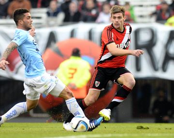 Con Saviola y Lucho González
