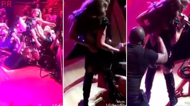 Un fan le bajó el cierre del vestido a Thalía.
