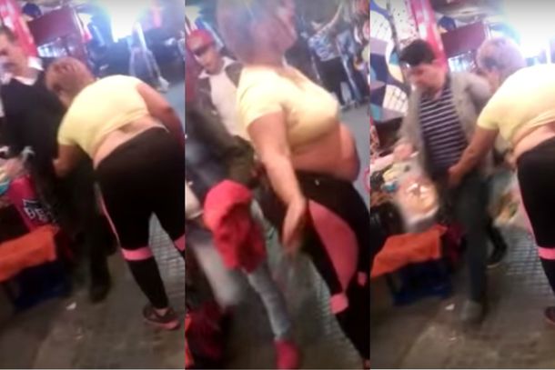 Mujer que baila y le toca sus partes a los hombres