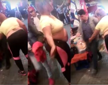 Mujer que baila y le toca sus partes a los hombres