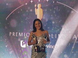 Delfina Pignatiello con los Olimpia de oro y plata