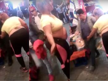 Mujer que baila y le toca sus partes a los hombres