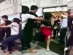 La mujer encuentra a su esposo con la amante y le pega en el aeropuerto La mujer encuentra a su esposo con la amante y le pega en el aeropuerto