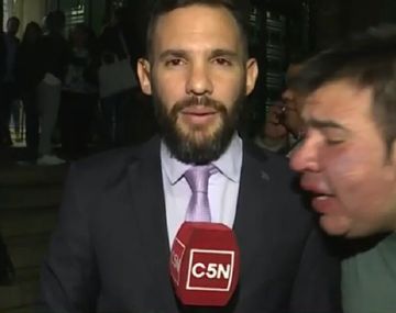 Nicolás Munafó y el joven que gritó Macri gato