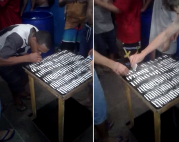 VIDEO: Presos hacen fila para aspirar de una mesa repleta de cocaína
