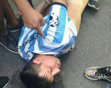 Acusaron de traidor a barra de Racing y le introdujeron un arma en el ano