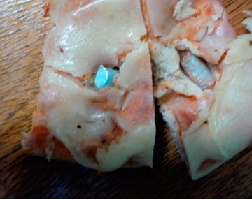 Quiso ingresar a la cárcel una pizza con marihuana y pastillas