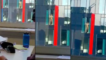 Una pareja tiene relaciones sexuales en la ventana de su edificio Una pareja tiene relaciones sexuales en la ventana de su edificio