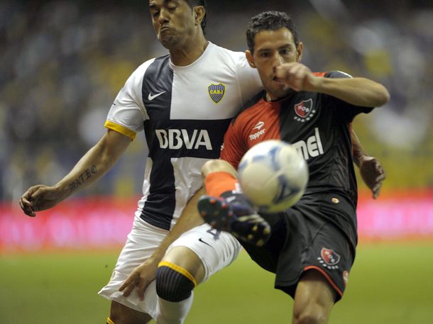 Boca y Newells sumaron un punto con gusto a poco